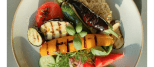 a balanced diabetic meal-steamed vegetables on a white plate, healthy home-cooked look.