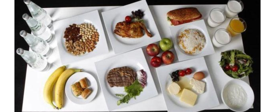 A healthy balanced diet for men including eggs, chicken, fish, fruits, vegetables and whole grains on a plate